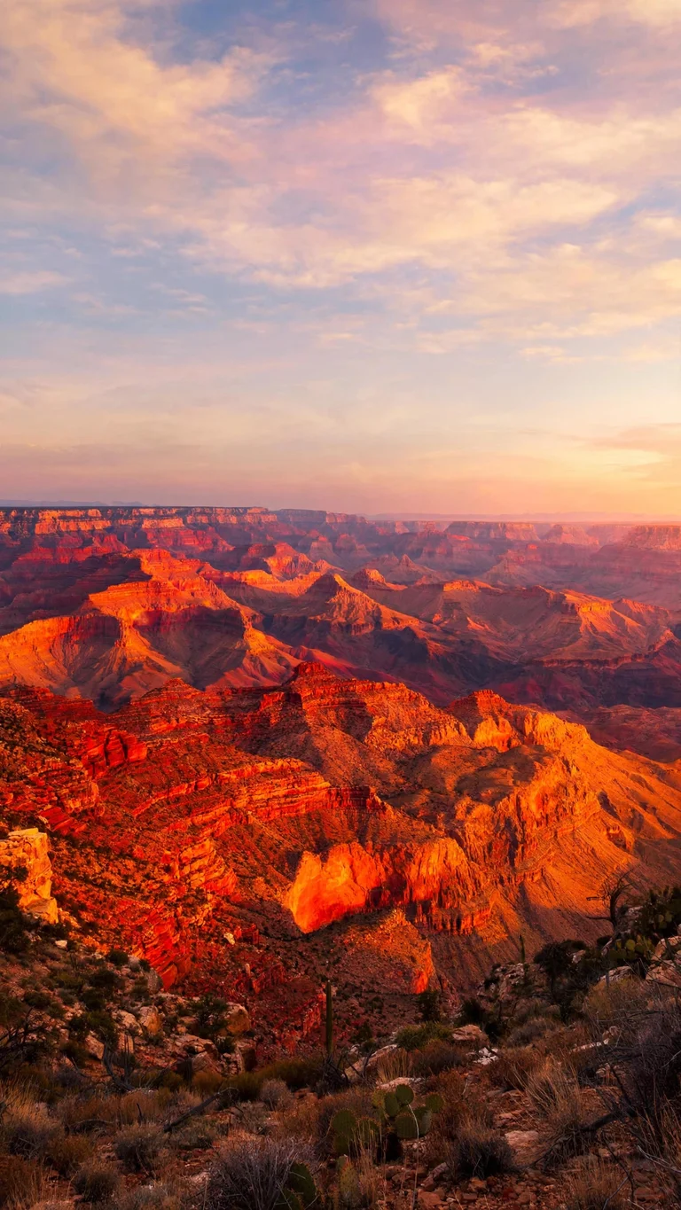 Grand Canyon glowing in fiery orange and red layers at sunset