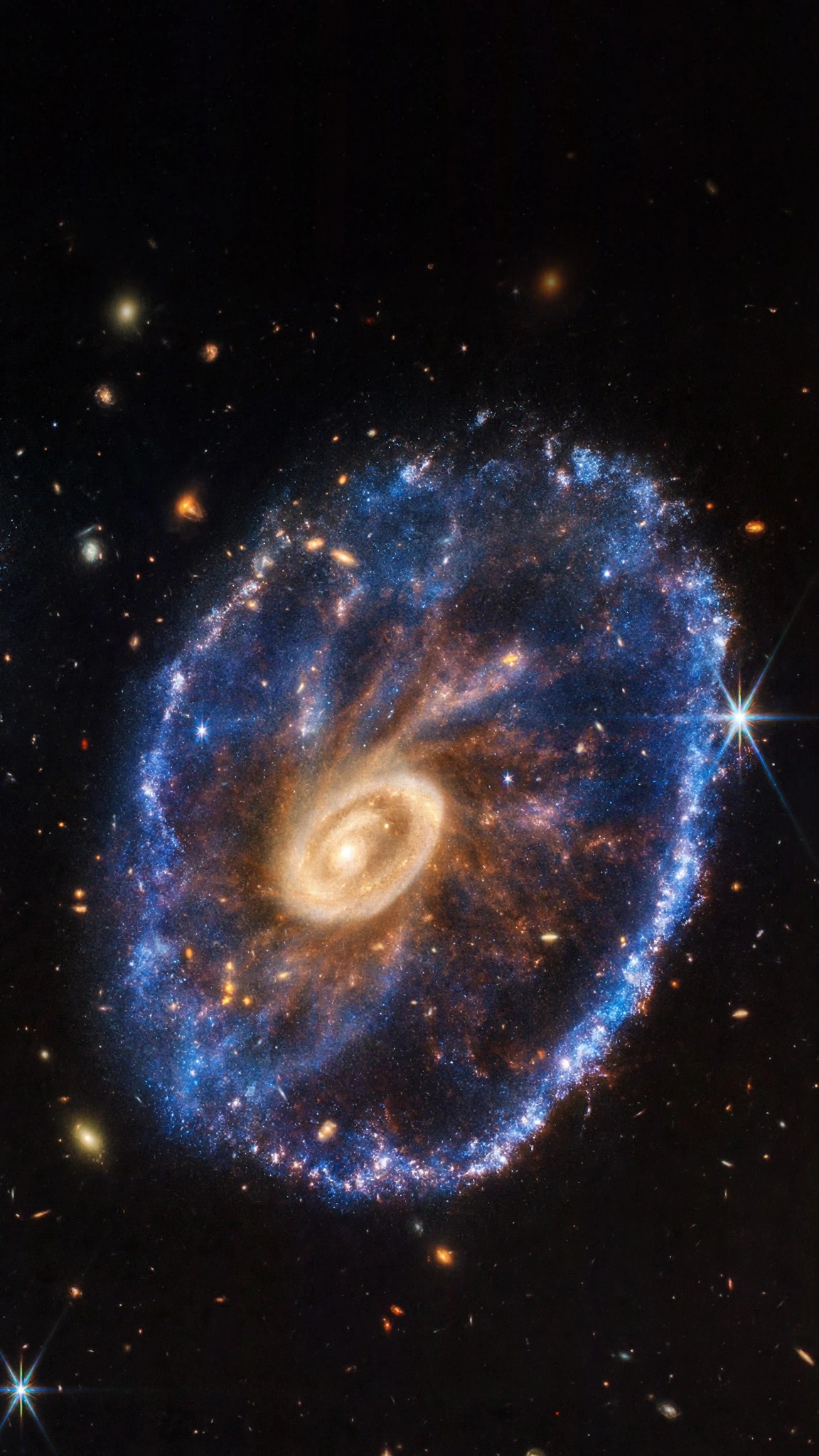 Cartwheel Galaxy with a blue star ring and golden core