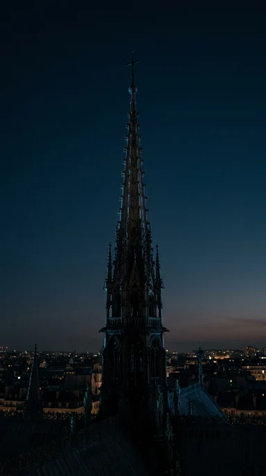 A gothic cathedral spire in twilight.
