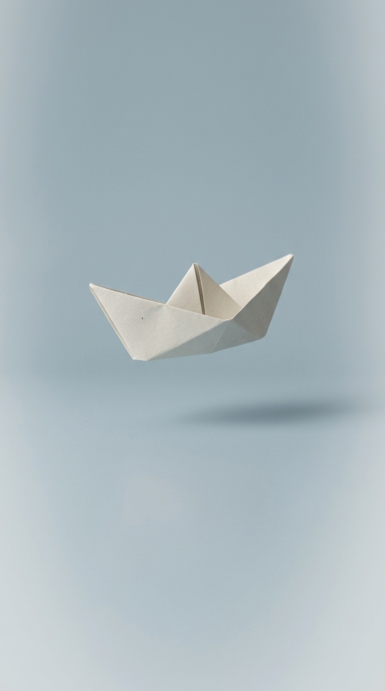 A floating folded paper boat.