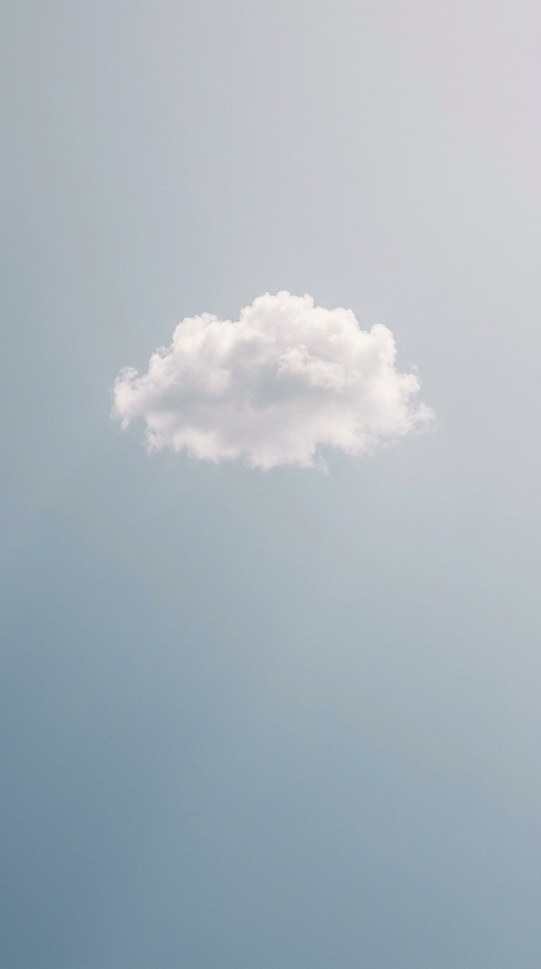 A single white cloud in open sky.