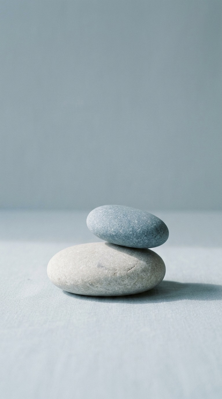 Two smooth balanced pebbles.