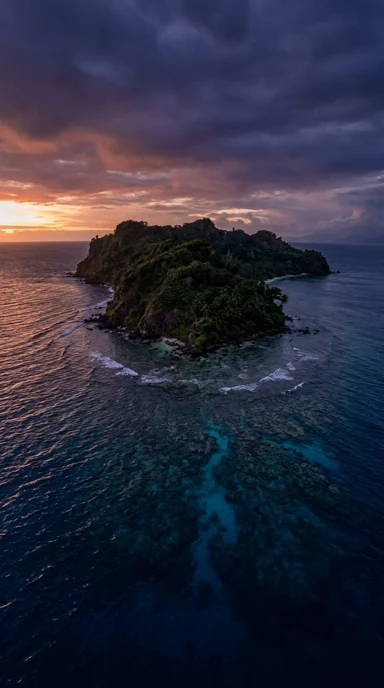 A deserted island ringed by coral.
